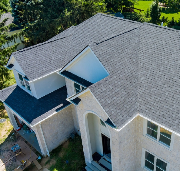New asphalt shingle roof installation in progress featuring premium GAF architectural shingles on a custom home in the Columbus, Ohio area.